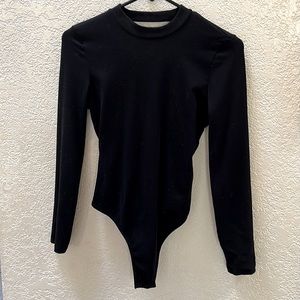 Open back, long sleeved bodysuit.